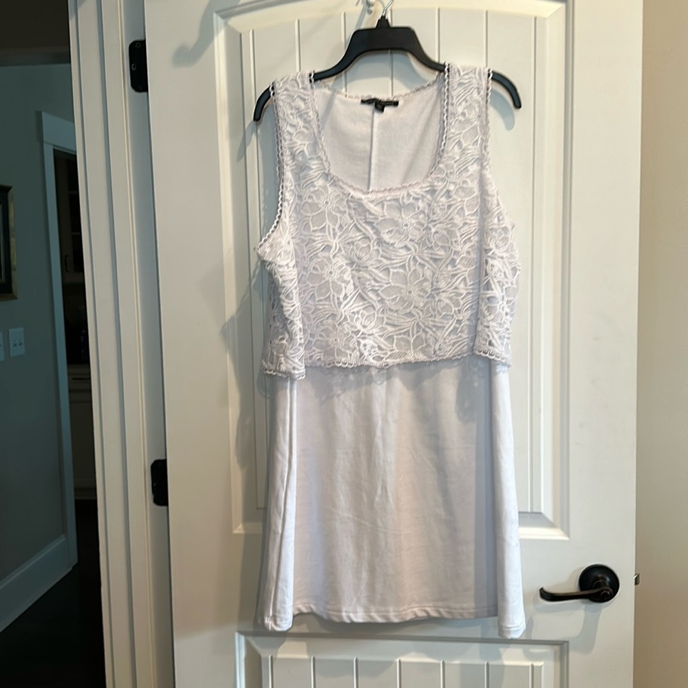 White sleeveless cotton dress.